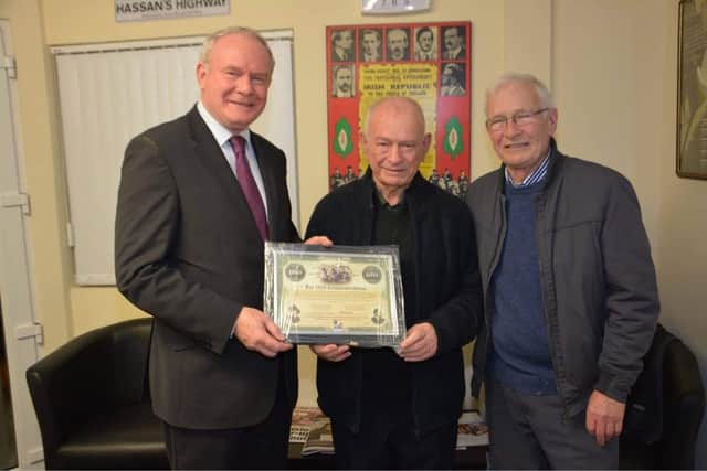 Bobby Kelly being presented with the 1916 100 Anniversary Centenary Bond by the late Martin McGuinness and his late Brother Brian.