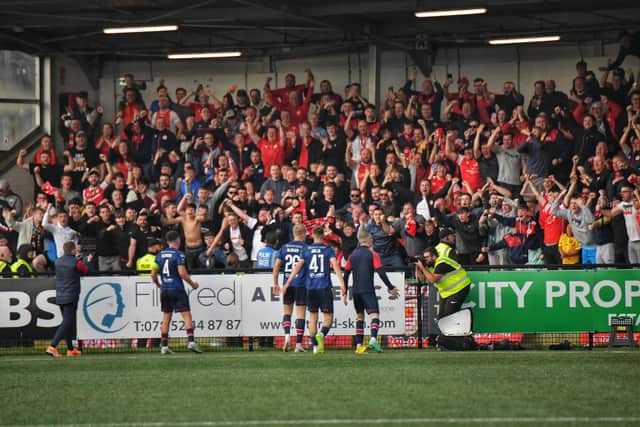St Patrick's Athletic players and supporters celebrate their shoot-out success at Brandywell on Sunday. (Photo: George Sweeney)
