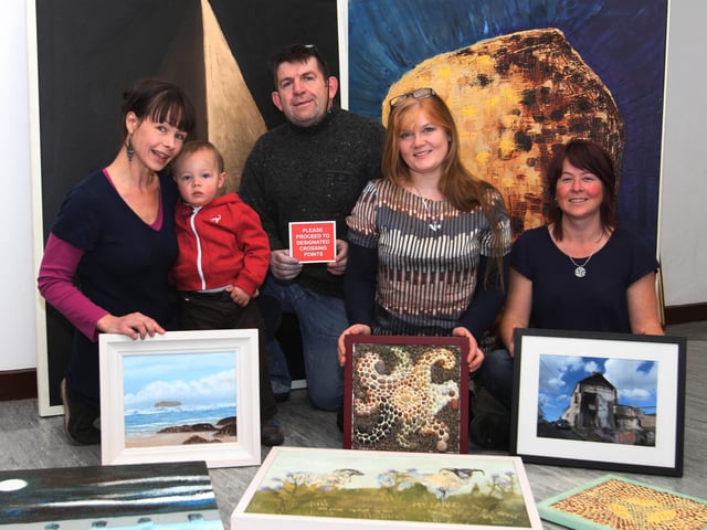Inishowen artists Sinead Smyth, Philip McFadden, Audrey Doherty and Darlene Corry with some of their work prior to the opening of the exhibition "Borderlands" at the Eden Place Arts Centre. (DER4613JB080)