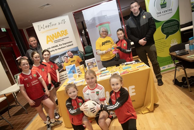 Coaches and players from Sean Dolan's GAC pictured with Margaret McCrossan, Aware on Tuesday night.