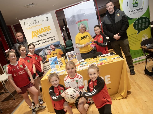 Coaches and players from Sean Dolan's GAC pictured with Margaret McCrossan, Aware on Tuesday night.