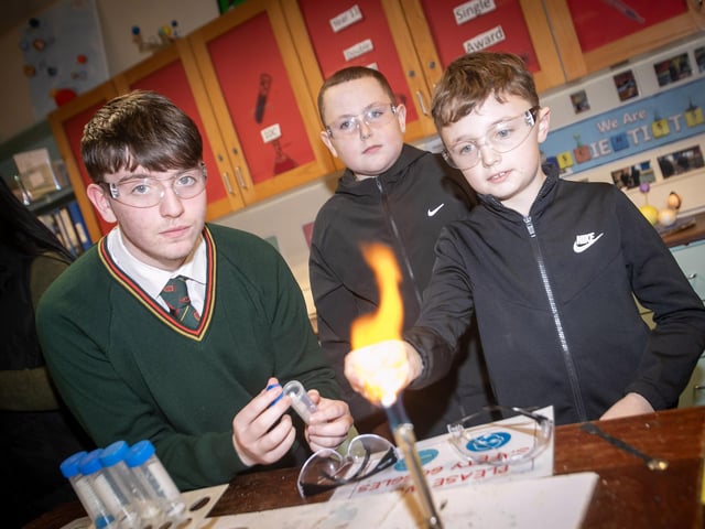 Visiting pupils Caleb Carlyle, Holy Child PS and James Jordan, Good Shepherd PS pictured taking part in an experiment with St. Joseph's student Shea Omora in the Biology Department on Thursday evening. (Photos: Jim McCafferty Photography)