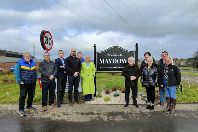 The Mayor Sandra Duffy with Martin McCartney, Chairperson from Maydown Community Association, and local community leaders with the new sign.