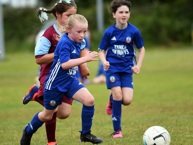 Carrie King powers forward for Buncrana Hearts during their girls under-9's match against Newbuildings United.
