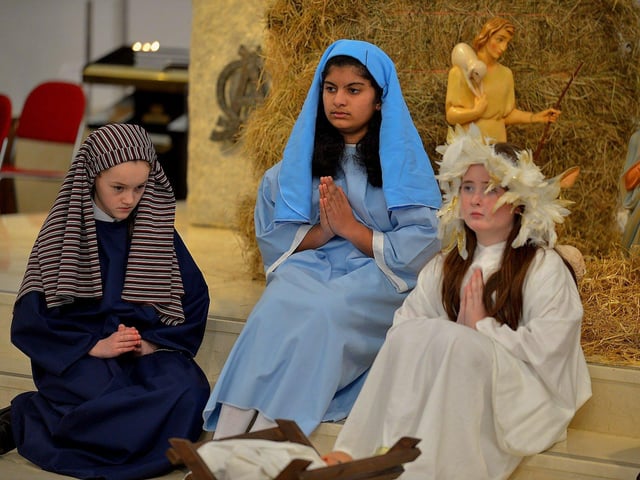 Students from St Cecilia’s College take part in a Nativity scene during a Carol Service held in St Mary’s Church, Creggan, on Tuesday afternoon. Photo: George Sweeney. DER2251GS – 04