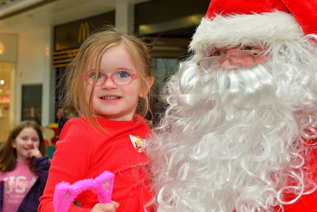 Santa poses for photographs at Foyleside Shopping Centre on Saturday morning. George Sweeney.  DER2244GS – 71 
