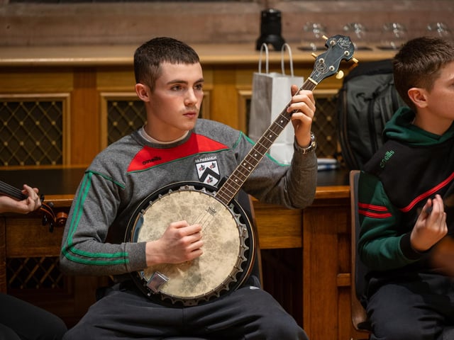 Doire Trasna GAC who are celebrating their 25th Anniversary received a commemorative crystal gift from the Mayor Councillor Ruairi McHugh in the Guildhall to mark their outstanding contribution to sport, community life and promotion of Gaelic games. During the evening the club’s traditional band and Irish dancers entertained guest with performances. Picture Martin McKeown. 22.01.26
