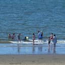 Bathers enjoy the sunshine at Lady’s Bay on Buncrana’s Shore Front, in 2021. Photo: George Sweeney. DER2128GS – 044