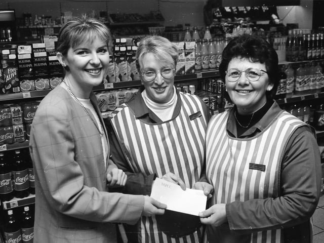 Staff presenting a cheque to the Foyle Hospice.
