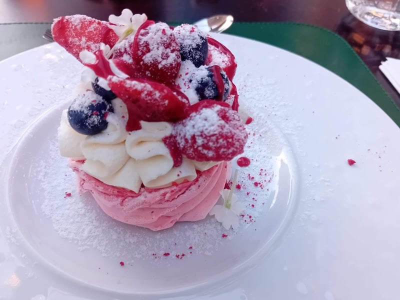 A fabulous raspberry meringue with vanilla cream, fresh fruits and red currant cremeux from Maniera Restaurant on Granary Island.