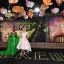 British actress and singer Cynthia Erivo (L) and US singer-songwriter and actress Ariana Grande attend Universal's "Wicked" premiere at the Dorothy Chandler Pavilion in Los Angeles, November 9, 2024. (Photo by VALERIE MACON / AFP) (Photo by VALERIE MACON/AFP via Getty Images)