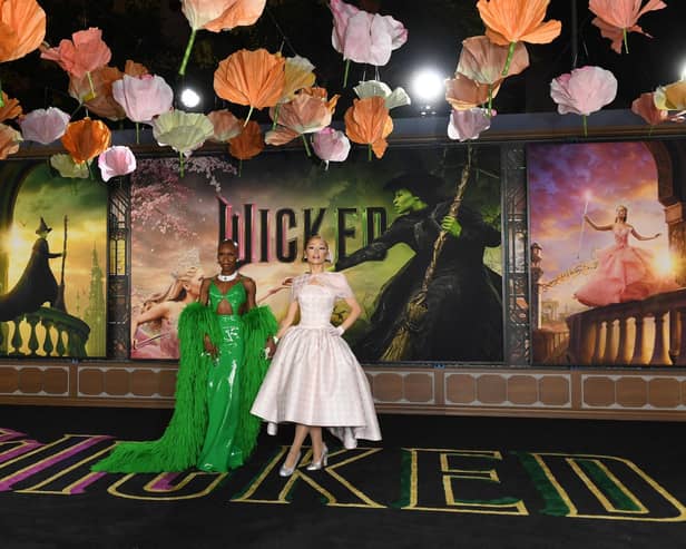 British actress and singer Cynthia Erivo (L) and US singer-songwriter and actress Ariana Grande attend Universal's "Wicked" premiere at the Dorothy Chandler Pavilion in Los Angeles, November 9, 2024. (Photo by VALERIE MACON / AFP) (Photo by VALERIE MACON/AFP via Getty Images)