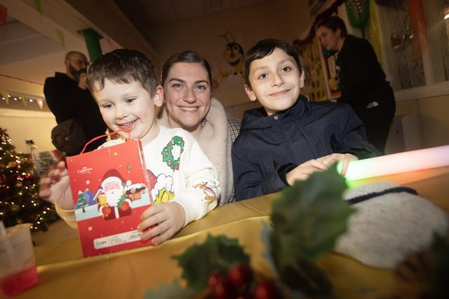 Taking time out for a hot drink at Holy Child on Thursday night is the McGrory family - mum Rebecca with sons Michael and Ethan.