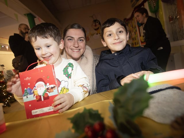 Taking time out for a hot drink at Holy Child on Thursday night is the McGrory family - mum Rebecca with sons Michael and Ethan.