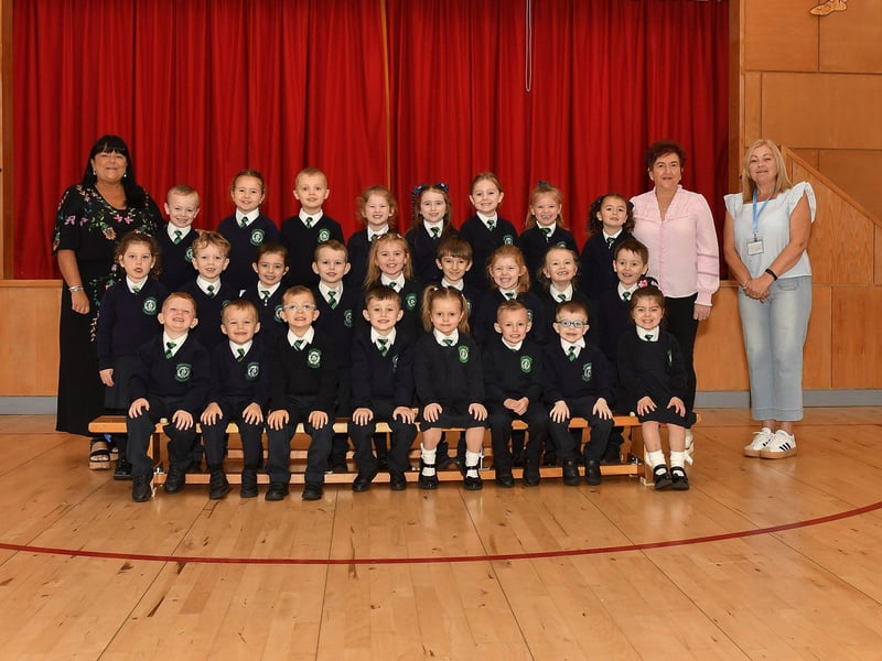 Mrs McGowan (left) teacher and Miss McCallion and Miss Dowds classroom assistants pictured with P1 pupils at St Patrick’s Primary School.