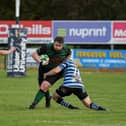 Ballymoney’s Matthew Pollock and Jordan Munnis combine to stop City of Derry’s Nathan Campbell during last week's Junior Cup tie. Photo: George Sweeney