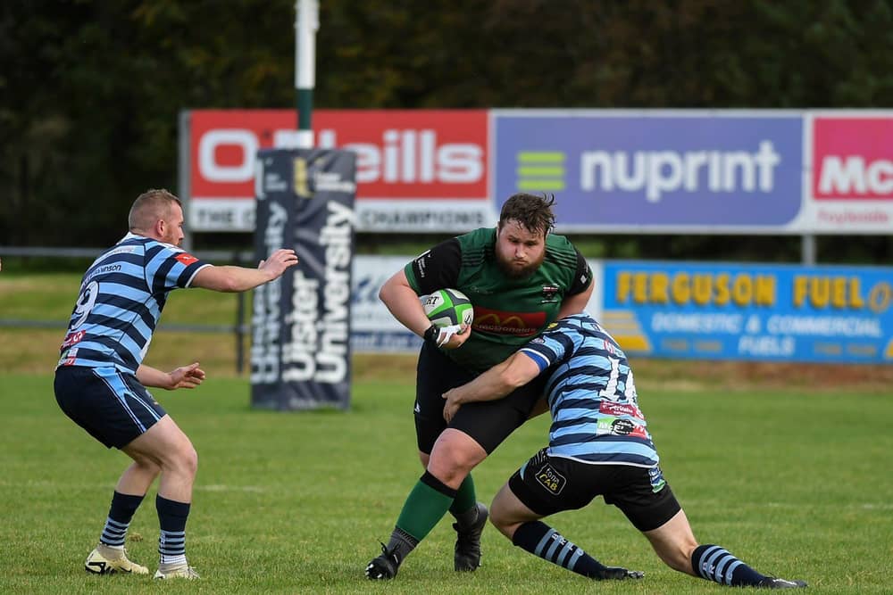 Ballymoney’s Matthew Pollock and Jordan Munnis combine to stop City of Derry’s Nathan Campbell during last week's Junior Cup tie. Photo: George Sweeney