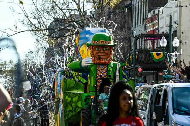People participate in the 2023 Krewe of Okeanos parade during Mardi Gras in New Orleans, Louisiana, on February 19, 2022. (Photo by CHANDAN KHANNA / AFP) (Photo by CHANDAN KHANNA/AFP via Getty Images)