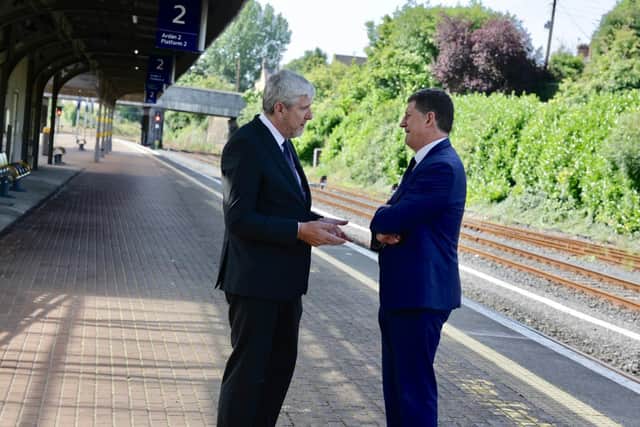 Transport ministers John O'Dowd and Eamon Ryan.