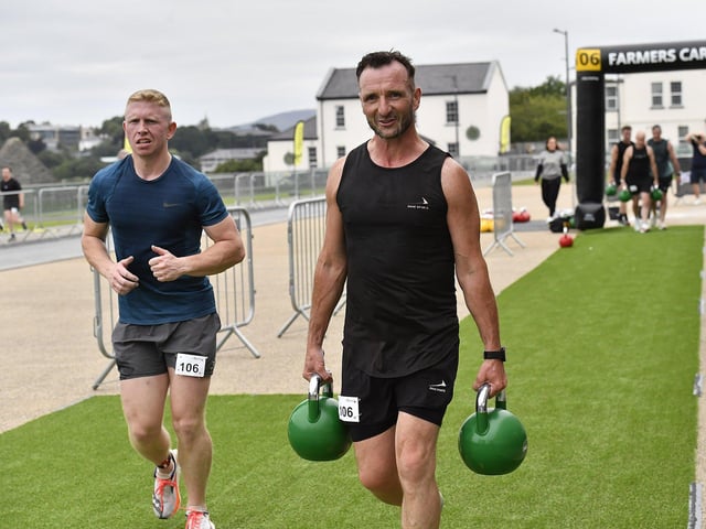 Competitors start the Farmer's Carries station in the Ebrington Hyrox on Saturday morning. Photo: George Sweeney