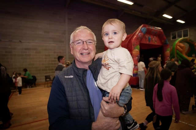 A great Brandywell man Sean Collins pictured with his grandson at Friday night's Féile 23 Big Night Out at the Long Tower Youth Club.