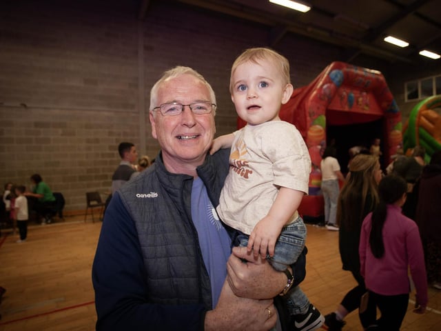 A great Brandywell man Sean Collins pictured with his grandson at Friday night's Féile 23 Big Night Out at the Long Tower Youth Club.