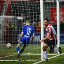 Derry City striker celebrates after putting the Brandywell club ahead against Waterford on Friday night. Photographs by Kevin Moore.