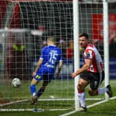 Derry City striker celebrates after putting the Brandywell club ahead against Waterford on Friday night. Photographs by Kevin Moore.