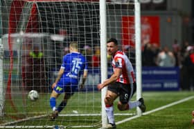 Derry City striker celebrates after putting the Brandywell club ahead against Waterford on Friday night. Photographs by Kevin Moore.