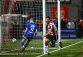 Derry City striker celebrates after putting the Brandywell club ahead against Waterford on Friday night. Photographs by Kevin Moore.