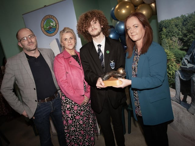 Troy Nixon, winner of The Artistic Endeavour Award receiving his award from Mrs. McCay, Acting Head of Art and Design at the St. Columb's College Senior Prizegiving last week. Included on left is Troy's parents.