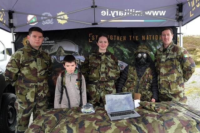 Two young lads pictured with members of the Defence Forces at the Emergency Services Showcase held at Fort Dunree, Inishowen, on Sunday. The event was organised by the members and volunteers of the Desertegney and Dunree Foróige Club.  Photo: George Sweeney