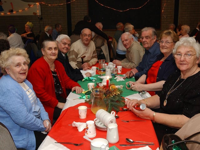From left, Mary Anne Doherty, Brigid McColgan, Alec Stewart, George Henderson, Danny Harkin, Willie McGilloway, Lily McGilloway, and Maureen McCallion. (0912PG25) :Christmas parties for Derry's senior citizens in December 2003