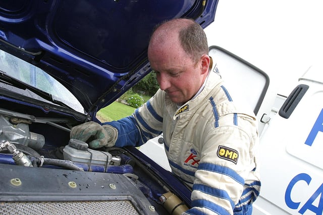 Letterkenny rally driver Andrew Hegarty, tuning the engine of his Fort Puma, during Lark in the Park.