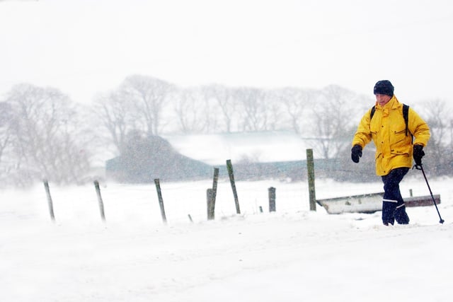 A walker braves the near blizzard conditions on Sheriffs Mountain yesterday as the North West's deteriorated over the weekend. (0402A43)