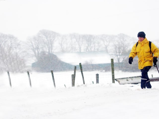 A walker braves the near blizzard conditions on Sheriffs Mountain yesterday as the North West's deteriorated over the weekend. (0402A43)
