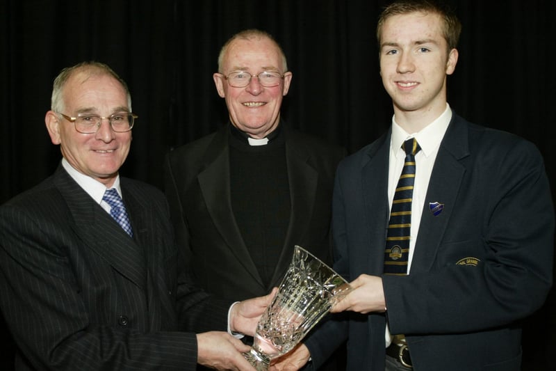 Ciaran Devlin, principal's award for outstanding Achievements receiving his award from Lumen Christi College principal, Mr. Declan O'Kelly.  Also in photo is Monsignor McQuillan.  (1001JB22)
