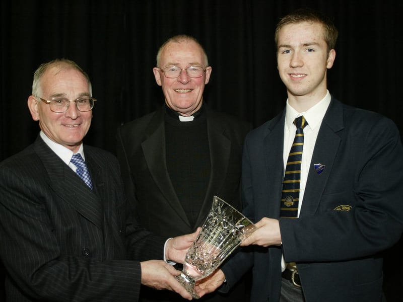 Ciaran Devlin, principal's award for outstanding Achievements receiving his award from Lumen Christi College principal, Mr. Declan O'Kelly.  Also in photo is Monsignor McQuillan.  (1001JB22)