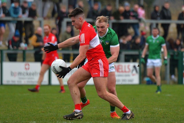 Limerick’s Adrain Enright challenges Conor Doherty of Derry during their Division Two game at Owenbeg on Saturday afternoon. Photo: George Sweeney. DER2305GS – 142