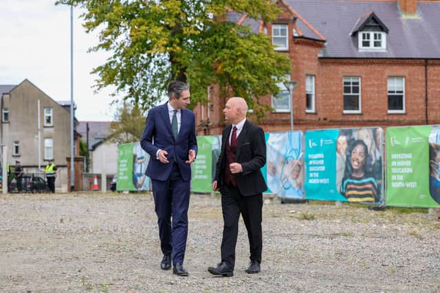 Taoiseach Simon Harris with Ulster University Vice Chancellor Professor Paul Bartholomew visiting the site at the Derry campus on which a new teaching and student services building will be developed, supported by cross border investment from the Irish Government and University reserves.