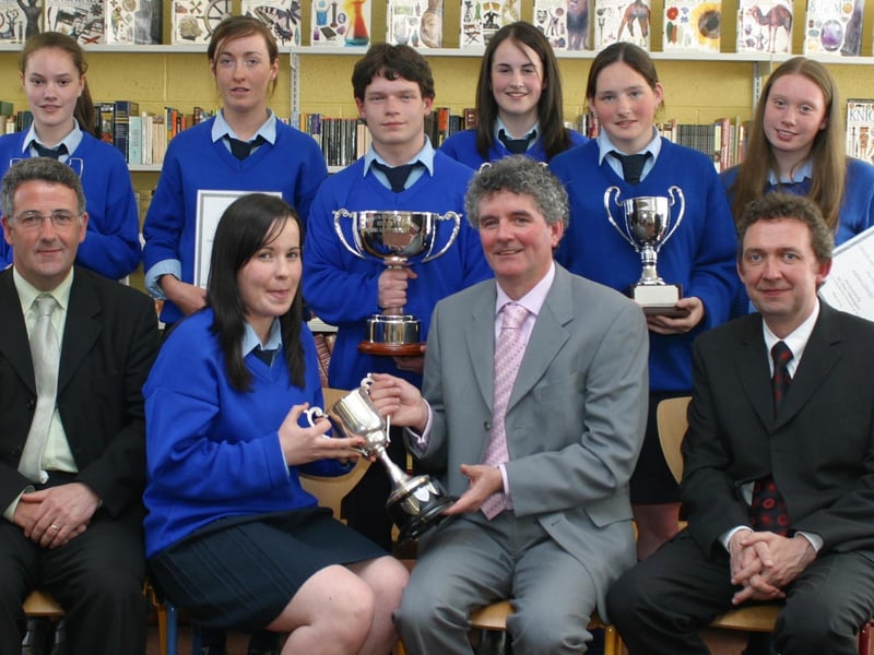 Scoil Mhuire College, principal Mr Liam Rainey presenting the Senior Student of the Year award to Michelle B McLaughlin at the schools prizegiving in 2004.  Included in photo are seated, Frank McHale and Guest of honour Paul Hannigan (Director Letterkenny Institute of Technology).  Standing are Tracey Durnin, Majella McGlinchey, Matthew Bonner, Susan Noone, Kerri Ferguson and Laura Gormley.  (2505JB91)