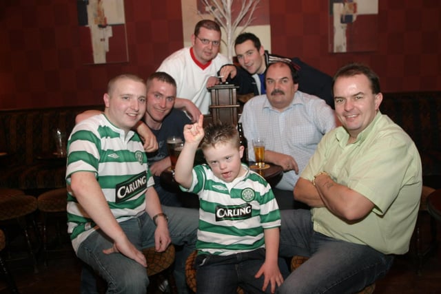 A group of lads watching the Auld Firm match in the 'Del' in January 2004.