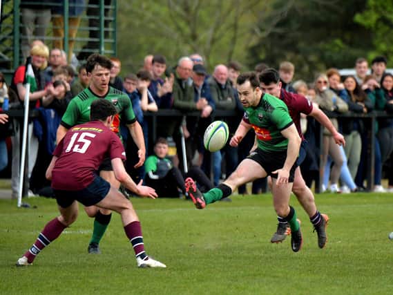 City of Derry’s Simon Logue kicks the ball forward into Enniskillen’s half . Photo: George Sweeney. DER2316GS – 57