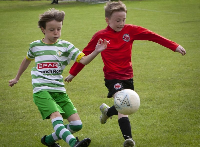 A battle for possession during the Top of the Hill Celtic v. Newell Academy on Sunday at St. Joseph’s Boys School.