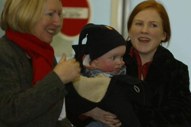 Siobhan Morris and her son Liam from Letterkenny, are greeted at City of Derry Airport yesterday by granmother Nora on their arrival from Manchester for the Christmas holidays.  (2312JB30) pic. Joe Boland