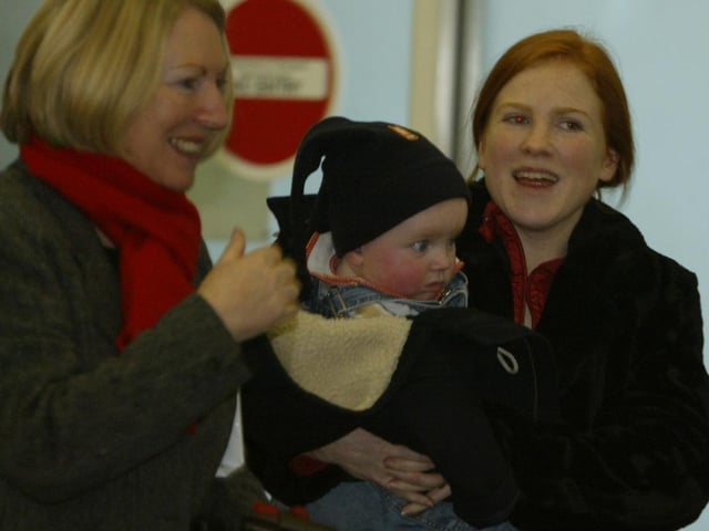 Siobhan Morris and her son Liam from Letterkenny, are greeted at City of Derry Airport yesterday by granmother Nora on their arrival from Manchester for the Christmas holidays.  (2312JB30) pic. Joe Boland