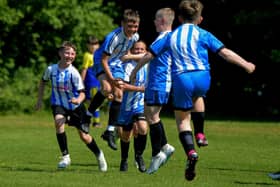 Strabane Athletic celebrate their first goal against Eglinton Eagles in the D&D U12 Championship Summer Cup final at Prehen on Sunday morning last. Photo: George Sweeney. DER2322GS - 42