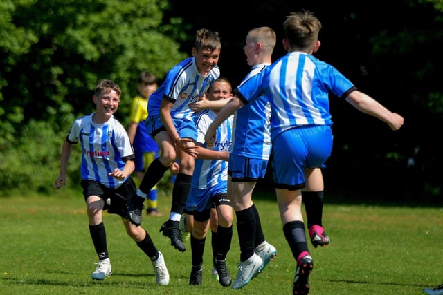 Strabane Athletic celebrate their first goal against Eglinton Eagles in the D&D U12 Championship Summer Cup final at Prehen on Sunday morning last. Photo: George Sweeney. DER2322GS - 42