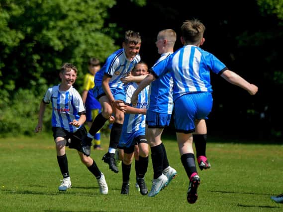Strabane Athletic celebrate their first goal against Eglinton Eagles in the D&D U12 Championship Summer Cup final at Prehen on Sunday morning last. Photo: George Sweeney. DER2322GS - 42