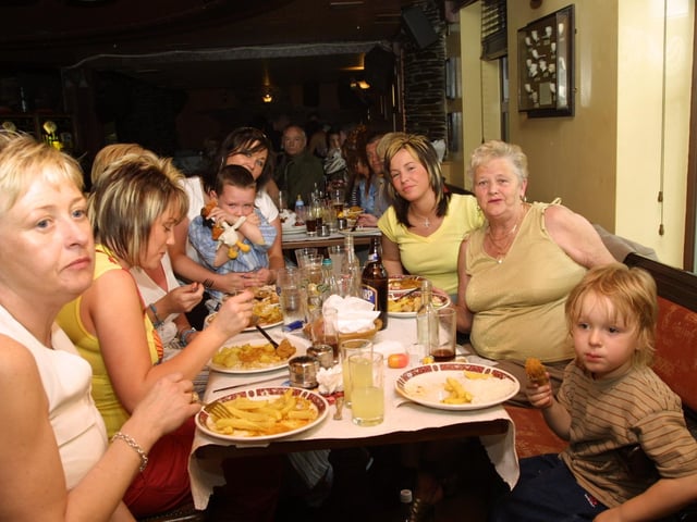 Friends and family enjoy a meal at Dukes